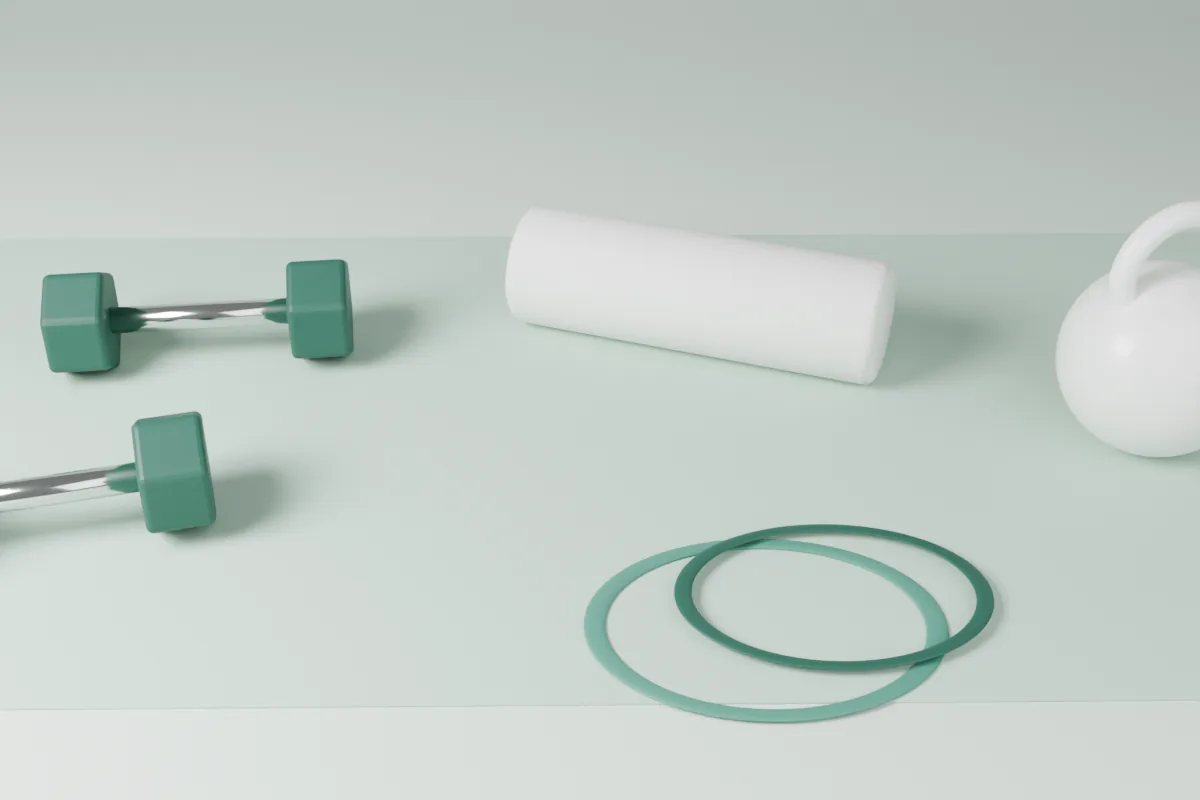 Physiotherapy equipment on a mint mat: dumbbells, a foam roller, resistance bands and a kettlebell